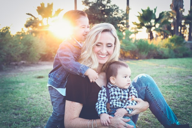 A happy mom with two kids.