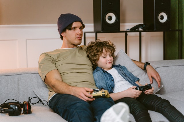 A father and a son playing video games