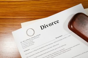 divorce myths, Golden ring on top of divorce papers