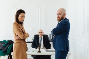 Couple arguing in front of the mediator during their divorce mediation