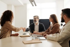 Couple shaking hands during their divorce mediation