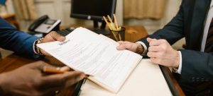 a man signing divorce papers