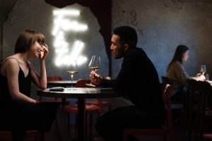 Two people drinking wine on a date